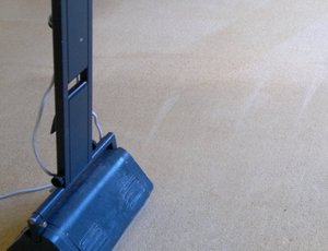 Dry compound brushing machine on carpet